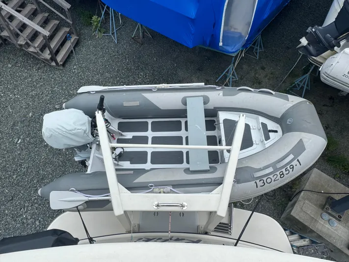 Rafiki Yacht Photos Pics Overhead view of a Nordic Tug 37 boat from 2000, docked with inflatable dinghy.