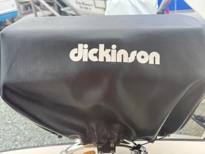 Rafiki Yacht Photos Pics Black Dickinson cover on Nordic Tug 37, year 2000, in a marina setting.