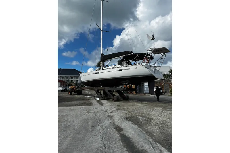 Further Yacht Photos Pics 2005 Beneteau Oceanis 473 sailboat on dry dock under cloudy sky.