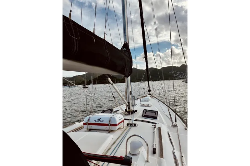 Further Yacht Photos Pics Sailing on a 2005 Beneteau Oceanis 473 yacht, scenic coastal view.