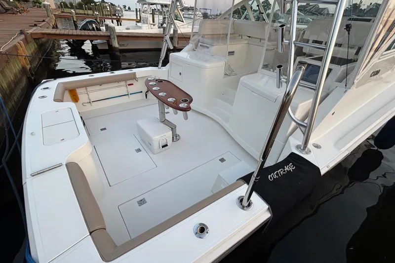  Yacht Photos Pics 2010 Cabo 36 Express boat with spacious deck and fishing amenities at dock.