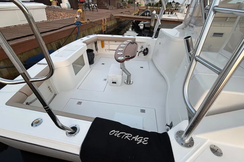  Yacht Photos Pics 2010 Cabo 36 Express boat deck with fishing chair and rod holders.