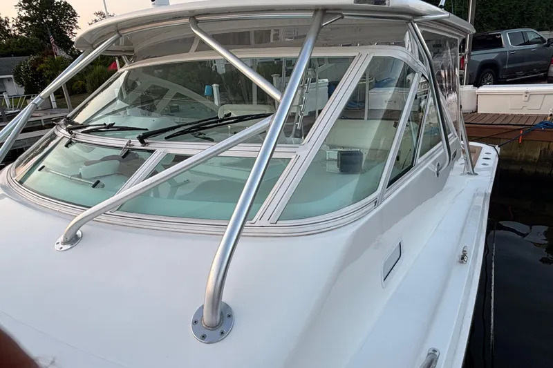  Yacht Photos Pics 2010 Cabo 36 Express boat with sleek design and sturdy windshield.