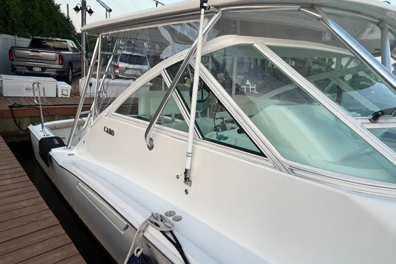  Yacht Photos Pics 2010 Cabo 36 Express boat docked, showcasing sleek design and sturdy construction.