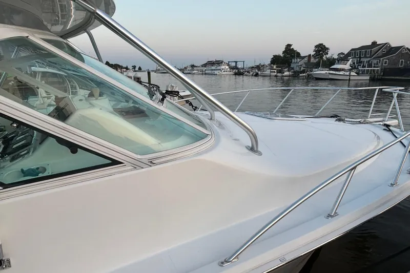  Yacht Photos Pics 2010 Cabo 36 Express boat docked in a serene marina setting.