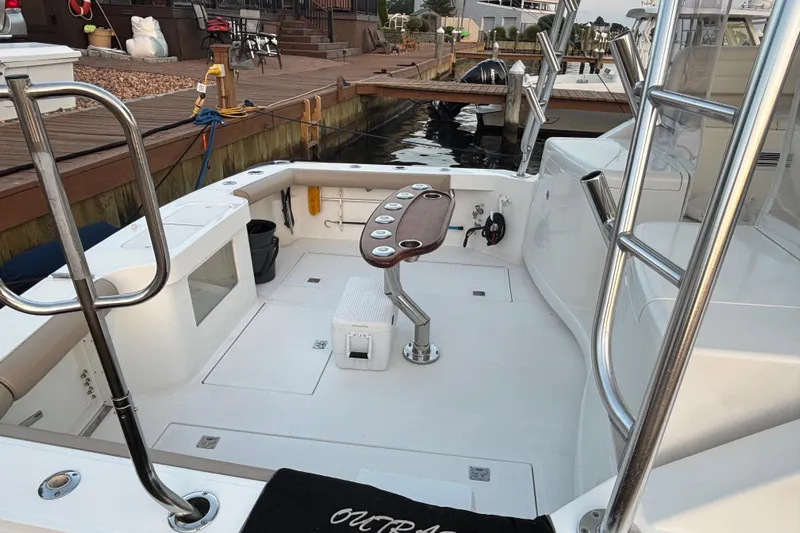  Yacht Photos Pics 2010 Cabo 36 Express boat deck with fishing chair and dock view.