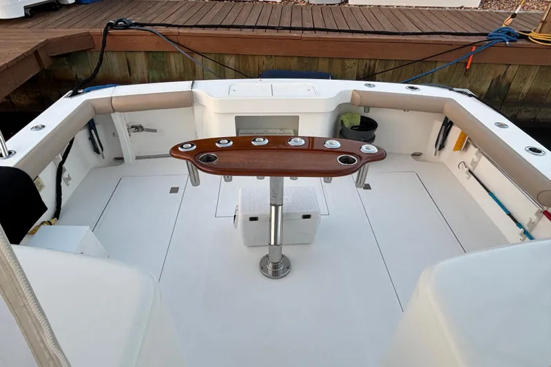  Yacht Photos Pics 2010 Cabo 36 Express boat cockpit with rod holders and cushioned seating.