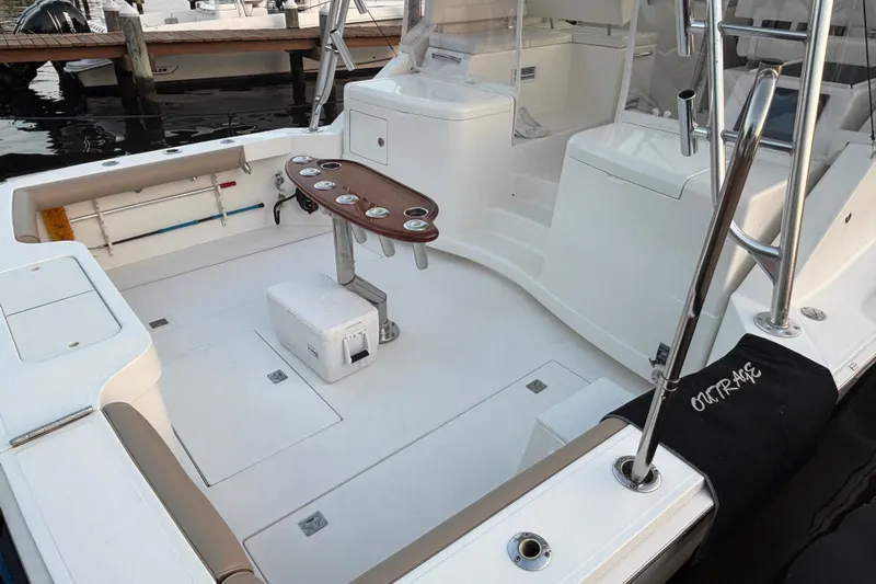  Yacht Photos Pics 2010 Cabo 36 Express boat interior with fishing rod holders and seating area.