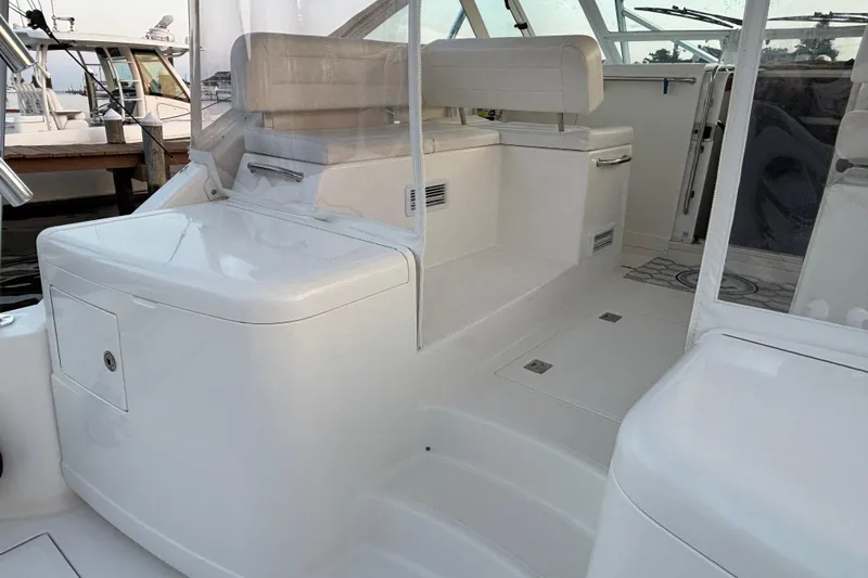  Yacht Photos Pics 2010 Cabo 36 Express boat interior with white seating and storage compartments.
