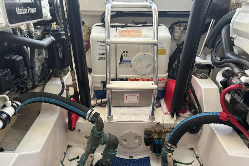  Yacht Photos Pics Engine room of 2010 Cabo 36 Express with Fischer Panda generator and marine components.