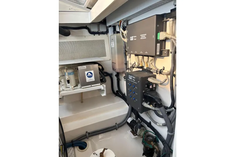  Yacht Photos Pics Engine room of 2010 Cabo 36 Express with CAT powertrain components and wiring.