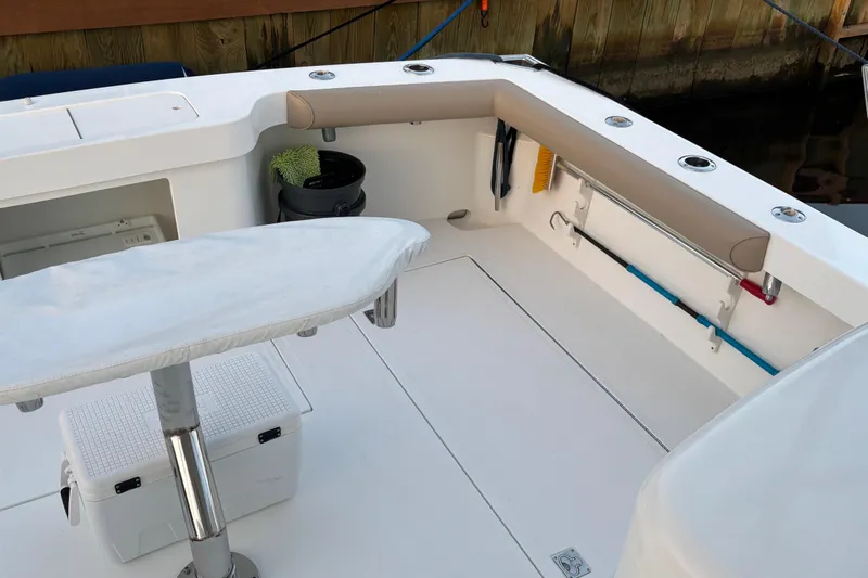  Yacht Photos Pics 2010 Cabo 36 Express boat deck with fishing gear and seating area.