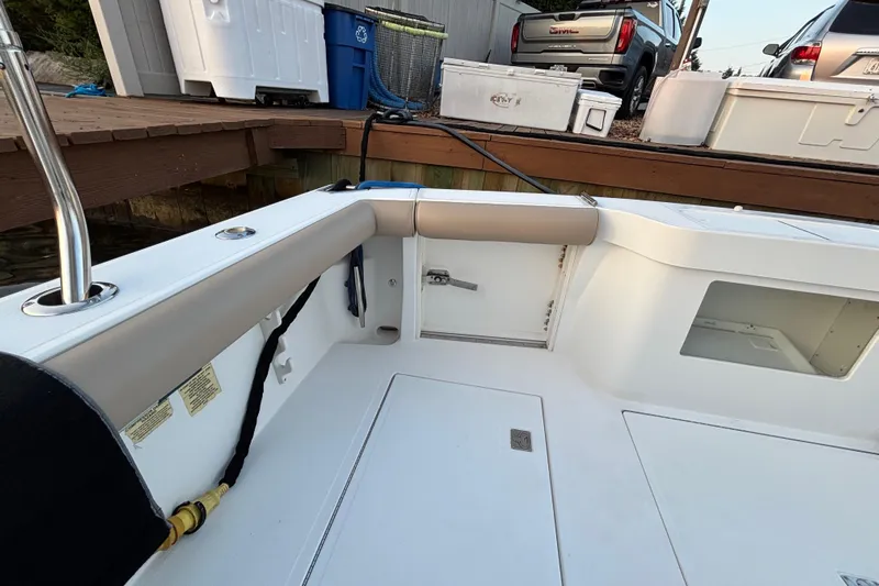  Yacht Photos Pics 2010 Cabo 36 Express boat interior near dock with storage compartments.