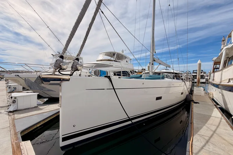 Cross Wind Yacht Photos Pics 2016 Moody Decksaloon 54 yacht docked at marina under clear blue sky.