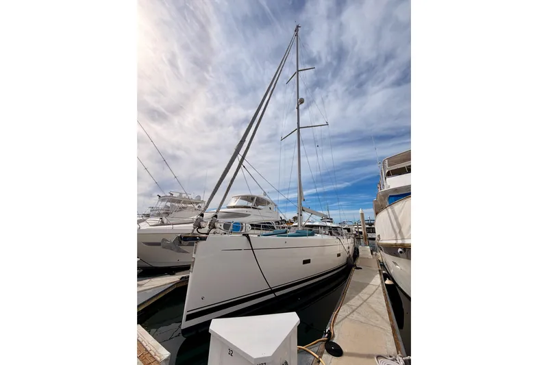 Cross Wind Yacht Photos Pics 2016 Moody Decksaloon 54 yacht docked under a partly cloudy sky.