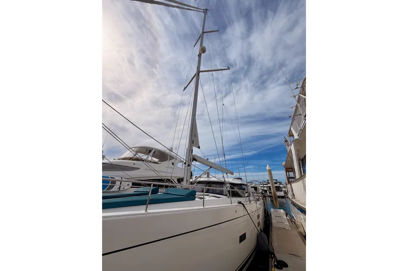Cross Wind Yacht Photos Pics Sailboat Moody Decksaloon 54, 2016 model, docked under a partly cloudy sky.