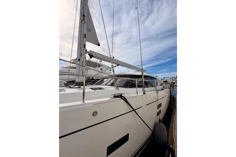 Cross Wind Yacht Photos Pics 2016 Moody Decksaloon 54 yacht docked under a partly cloudy sky.