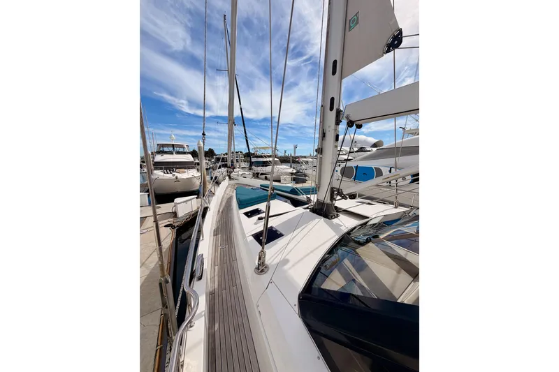 Cross Wind Yacht Photos Pics Sailing yacht Moody Decksaloon 54, 2016 model, docked at marina under blue sky.