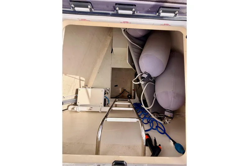 Cross Wind Yacht Photos Pics Storage compartment of 2016 Moody Decksaloon 54 yacht with equipment and fenders.