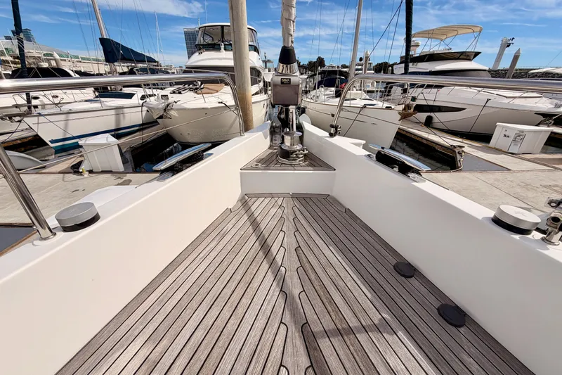 Cross Wind Yacht Photos Pics Moody Decksaloon 54 (2016) yacht docked at marina, showcasing sleek deck design.