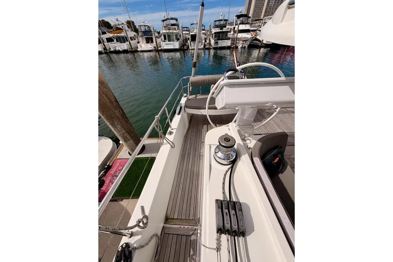 Cross Wind Yacht Photos Pics 2016 Moody Decksaloon 54 yacht deck with marina view, featuring modern sailing equipment.