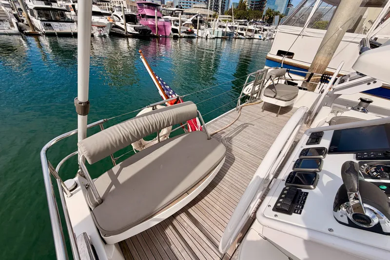 Cross Wind Yacht Photos Pics Luxurious 2016 Moody Decksaloon 54 yacht docked in a marina, featuring elegant deck seating.