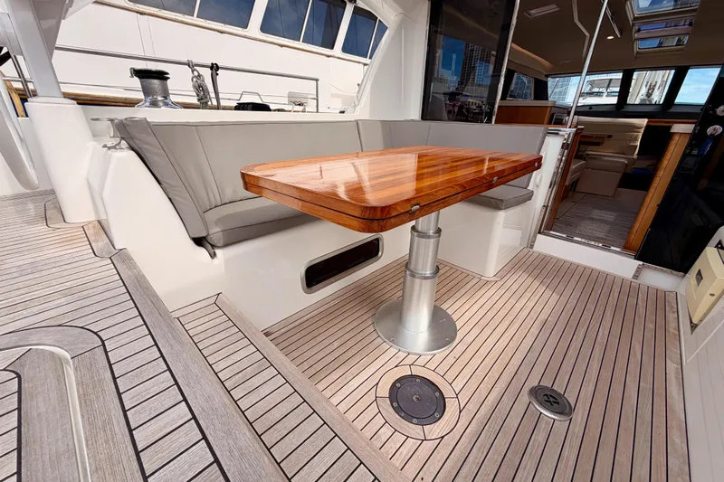 Cross Wind Yacht Photos Pics Luxurious 2016 Moody Decksaloon 54 yacht interior with elegant wooden table and seating area.