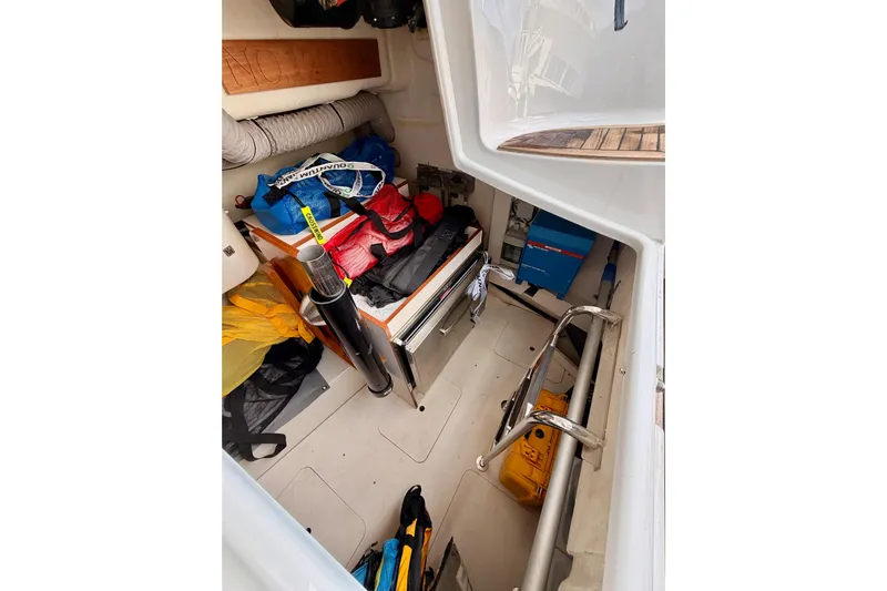 Cross Wind Yacht Photos Pics Storage compartment of 2016 Moody Decksaloon 54 yacht, filled with equipment and supplies.