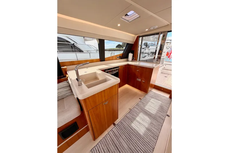 Cross Wind Yacht Photos Pics Luxurious interior of 2016 Moody Decksaloon 54 yacht with modern kitchen design.
