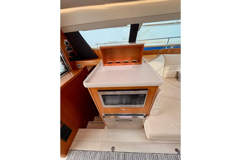 Cross Wind Yacht Photos Pics Luxurious interior of 2016 Moody Decksaloon 54 yacht with modern kitchen amenities.