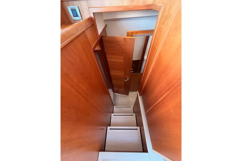 Cross Wind Yacht Photos Pics Staircase inside 2016 Moody Decksaloon 54 yacht with wooden interior design.