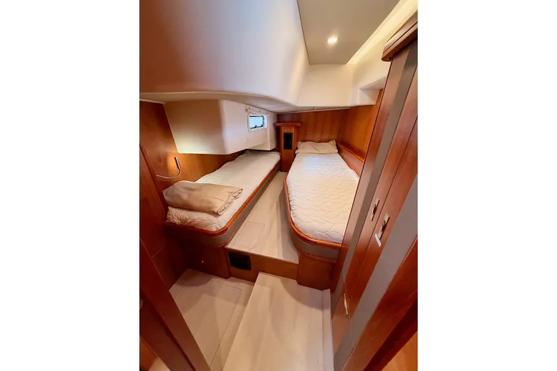 Cross Wind Yacht Photos Pics Cozy twin cabin in 2016 Moody Decksaloon 54 yacht with wooden interior.