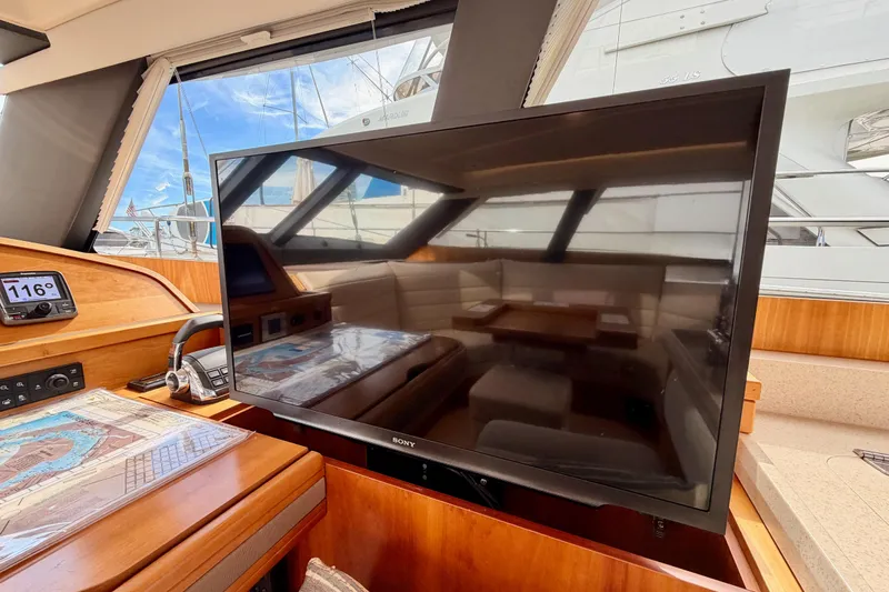 Cross Wind Yacht Photos Pics Interior of 2016 Moody Decksaloon 54 yacht with TV and navigation equipment.