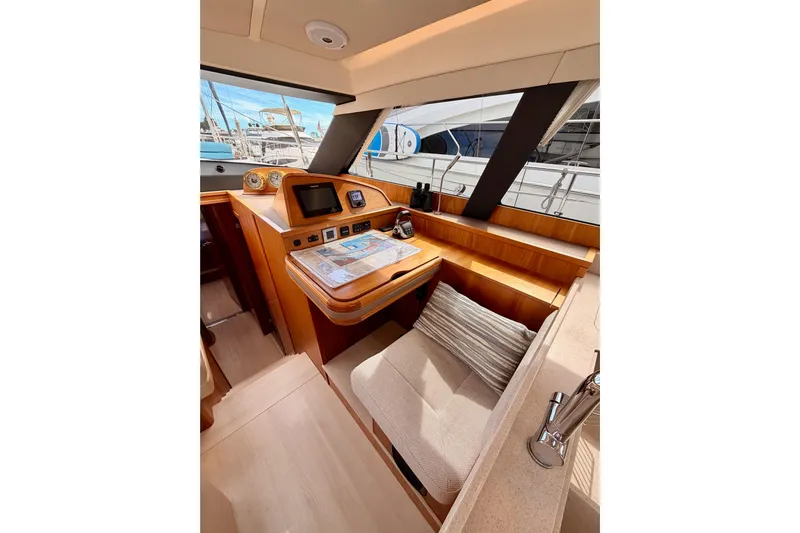 Cross Wind Yacht Photos Pics Luxurious interior of 2016 Moody Decksaloon 54 yacht with navigation station.