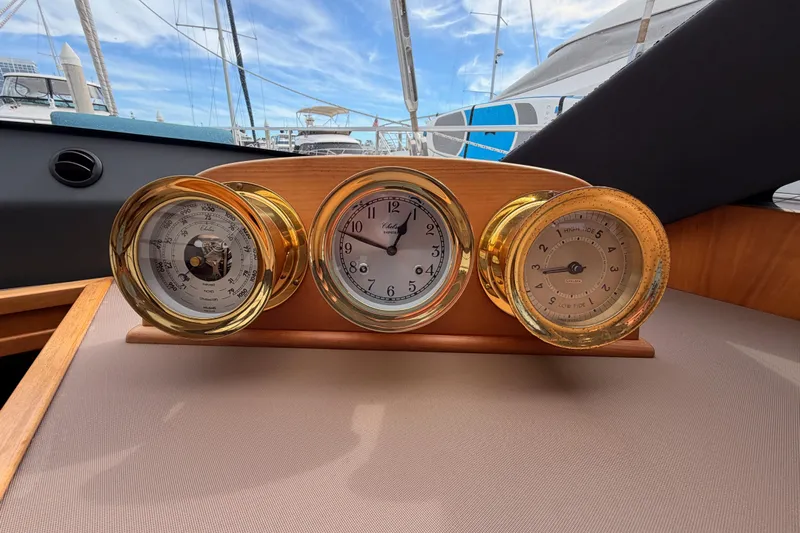 Cross Wind Yacht Photos Pics Golden nautical instruments on Moody Decksaloon 54 yacht, 2016 model, with marina view.