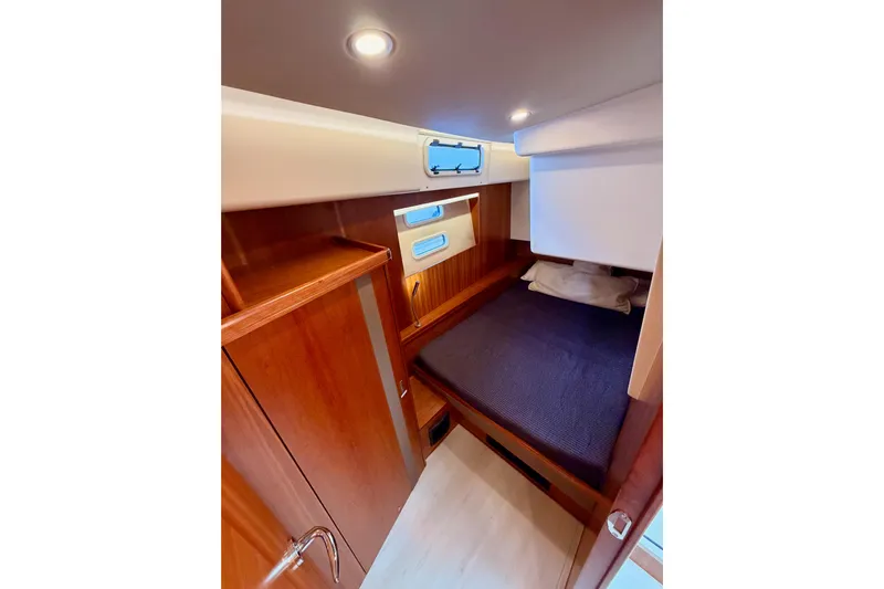 Cross Wind Yacht Photos Pics Cozy cabin interior of 2016 Moody Decksaloon 54 yacht with wooden finish.
