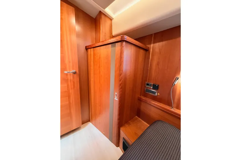 Cross Wind Yacht Photos Pics Interior of 2016 Moody Decksaloon 54 yacht with wooden cabinetry and modern fixtures.