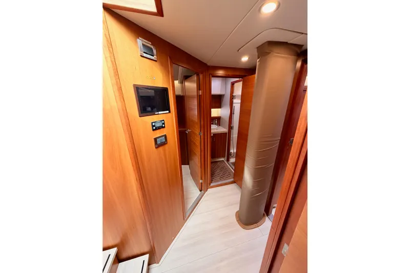 Cross Wind Yacht Photos Pics Interior of 2016 Moody Decksaloon 54 yacht, featuring wooden paneling and modern amenities.
