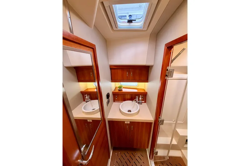 Cross Wind Yacht Photos Pics Luxurious bathroom interior of 2016 Moody Decksaloon 54 yacht with wooden finishes.