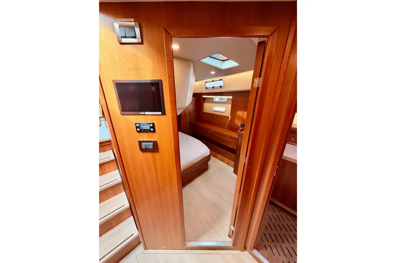 Cross Wind Yacht Photos Pics Interior of 2016 Moody Decksaloon 54 yacht, featuring wooden finishes and modern design.