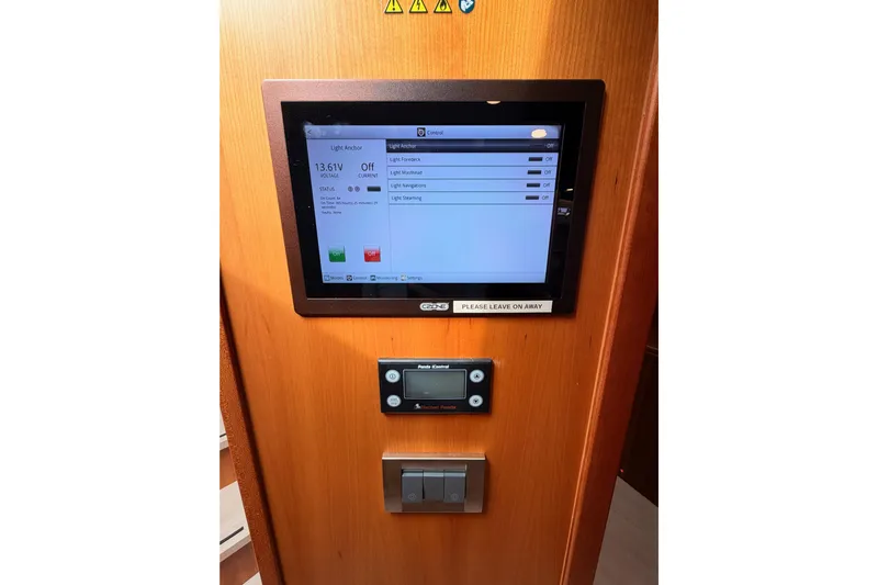 Cross Wind Yacht Photos Pics Control panel on a 2016 Moody Decksaloon 54 yacht, displaying light settings and voltage.