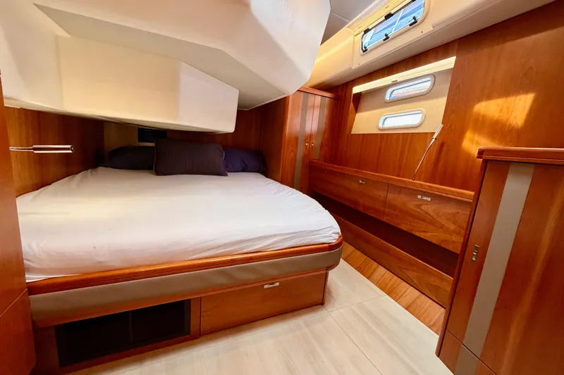 Cross Wind Yacht Photos Pics Luxurious cabin interior of 2016 Moody Decksaloon 54 yacht with wooden furnishings.