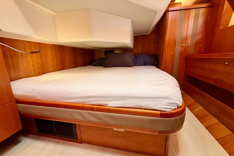 Cross Wind Yacht Photos Pics Luxurious cabin interior of 2016 Moody Decksaloon 54 yacht with wooden finishes.