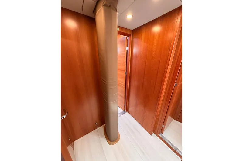 Cross Wind Yacht Photos Pics Interior of 2016 Moody Decksaloon 54 yacht with wooden walls and column.