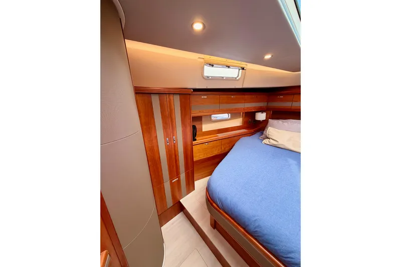 Cross Wind Yacht Photos Pics Luxurious cabin interior of 2016 Moody Decksaloon 54 yacht with wooden finishes.