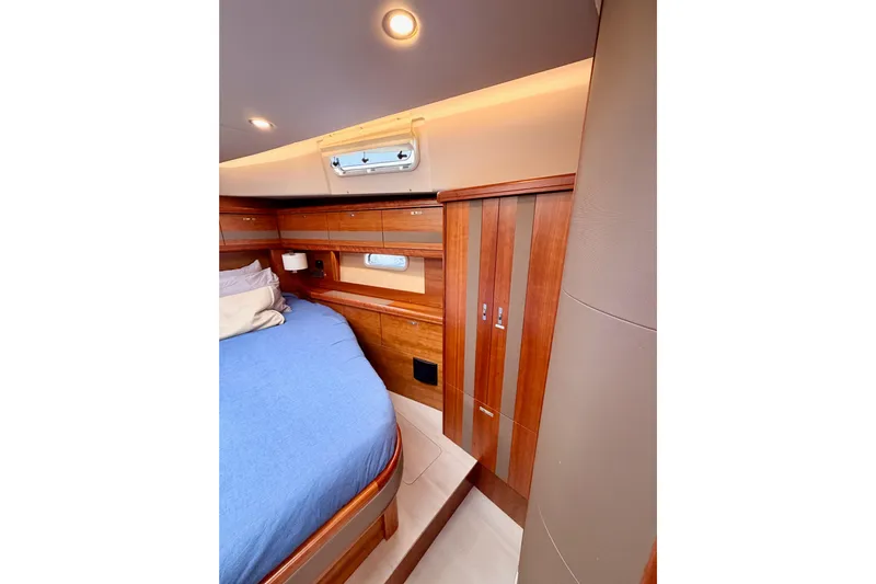 Cross Wind Yacht Photos Pics Luxurious cabin interior of 2016 Moody Decksaloon 54 yacht with wooden finishes.