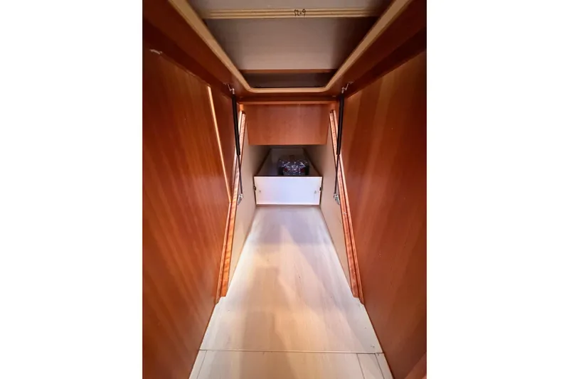 Cross Wind Yacht Photos Pics Interior hallway of 2016 Moody Decksaloon 54 yacht with wooden paneling.
