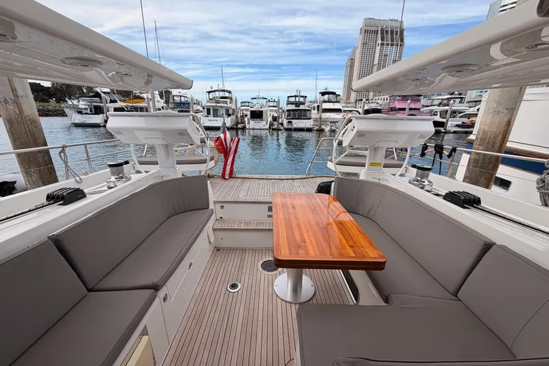 Cross Wind Yacht Photos Pics Luxurious 2016 Moody Decksaloon 54 yacht interior with elegant seating and wooden table.