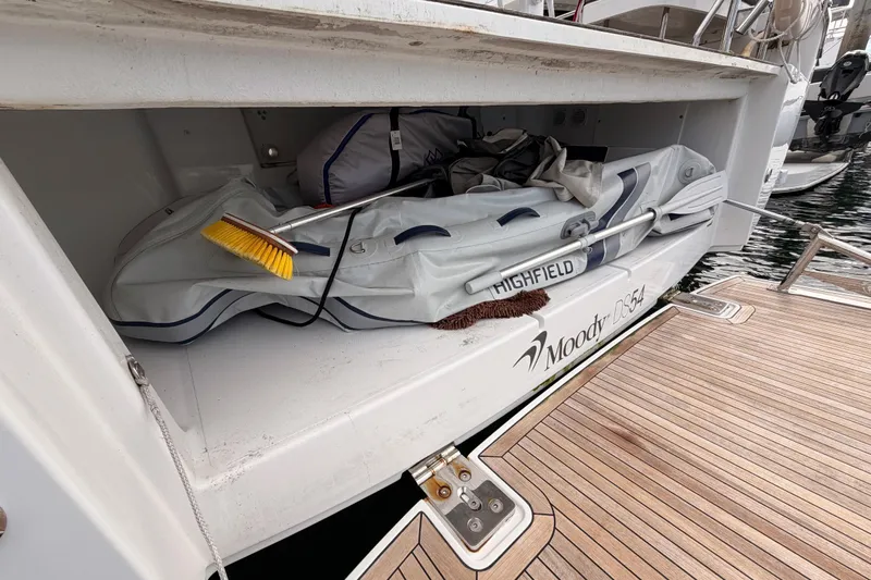 Cross Wind Yacht Photos Pics Storage compartment on 2016 Moody Decksaloon 54 yacht with inflatable boat and cleaning supplies.