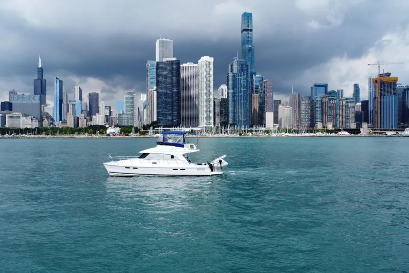 Vita Nova Yacht Photos Pics Boat on water with city skyline backdrop, Aspen C120, 2018 model.